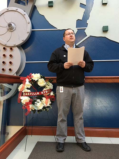 Mike Paquette speaks to attendees assembled on the Day of Mourning