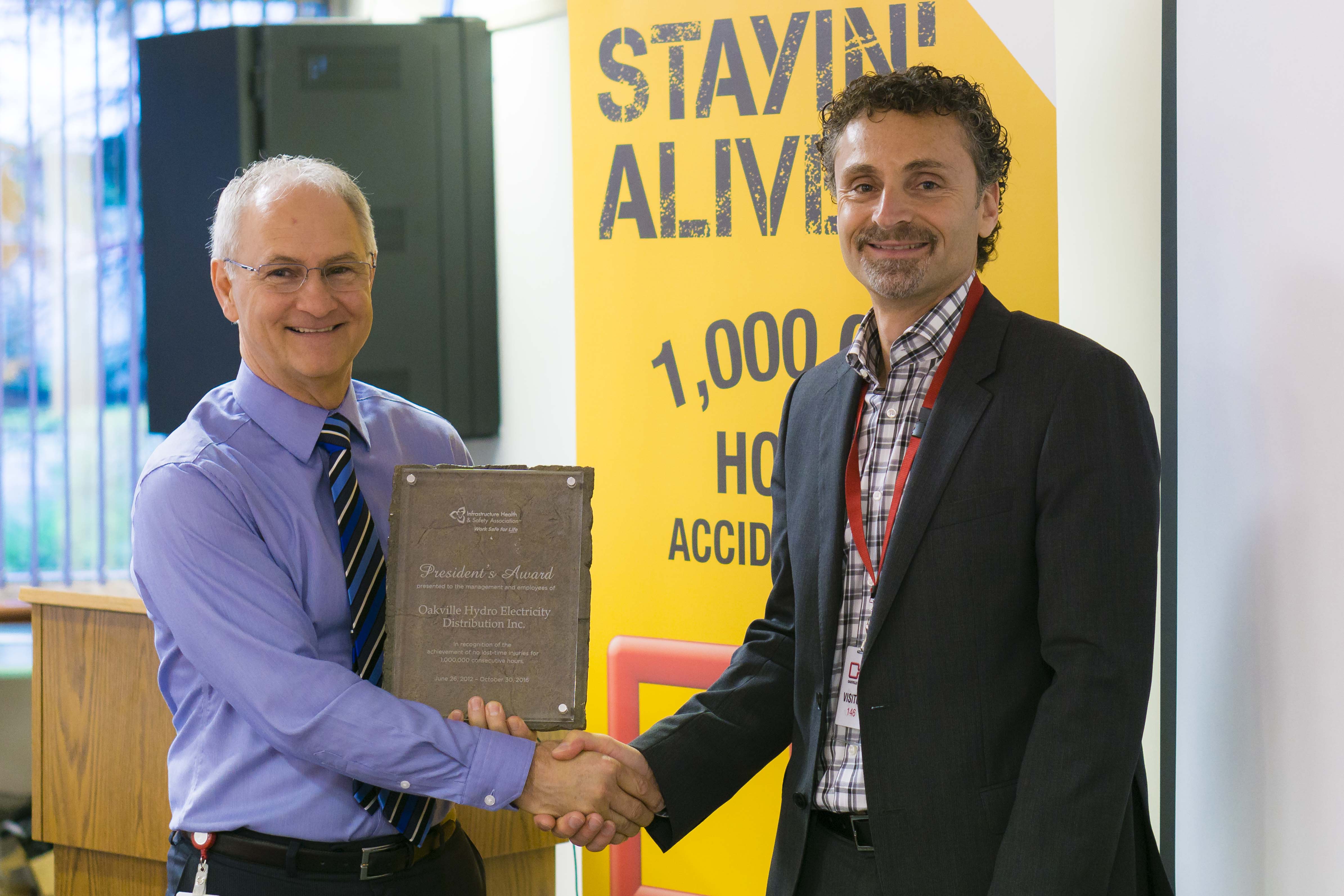 Rob Lister, President and CEO at Oakville Hydro with Enzo Garritano, President and CEO at Infrastructure Health and Safety Association