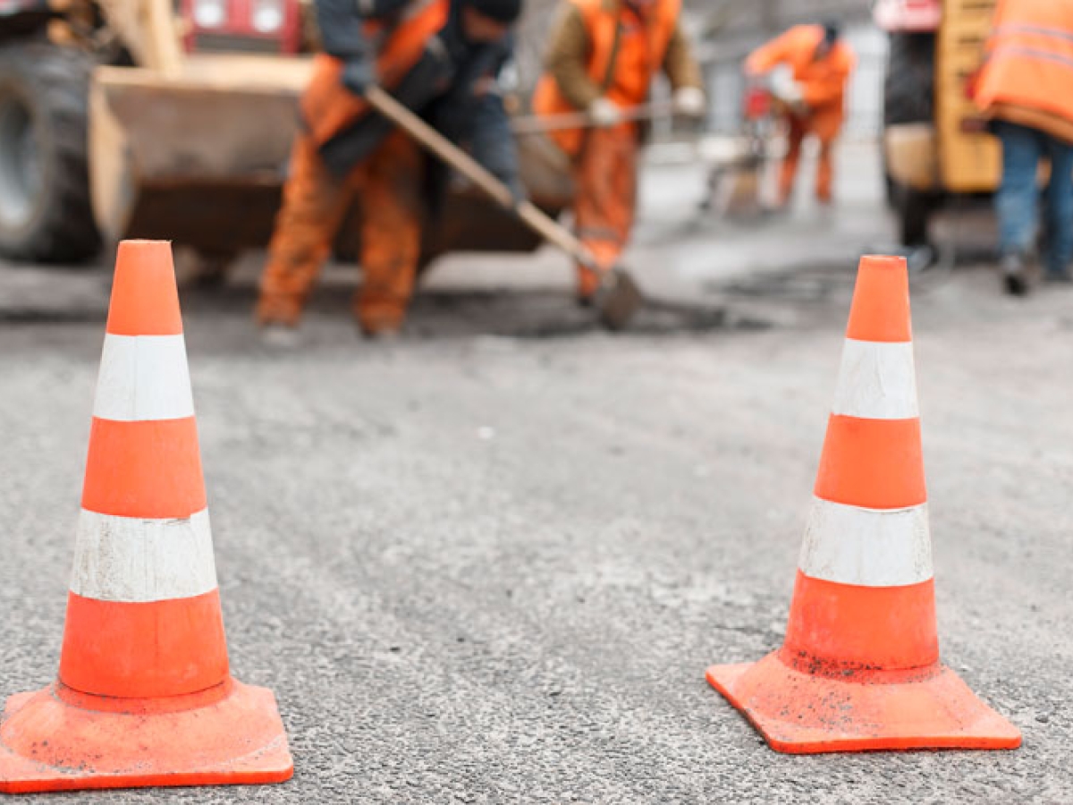 Orange pylons in front of  construction work