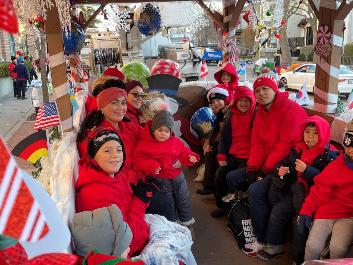 Float filled with smiling adults and children